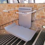 Lift for wheelchair on steel stairs outside